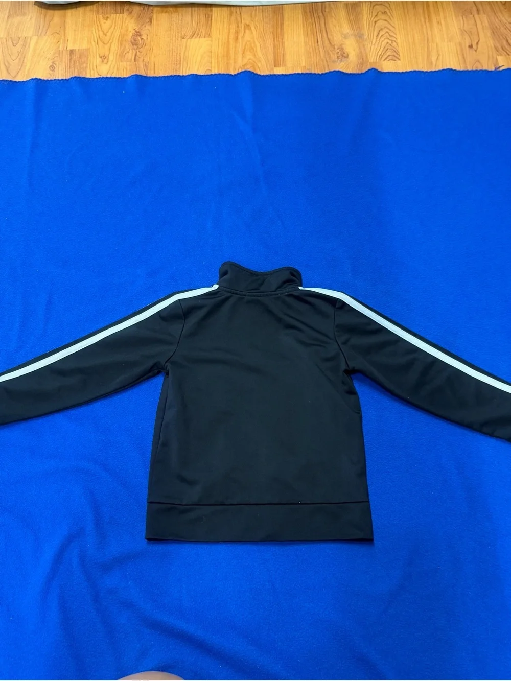 Adidas Black Jacket with White Sleeve Stripes kids 4 has flaws